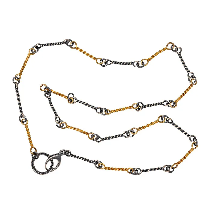 Hand crafted chain in sterling and 18k gold 18" long