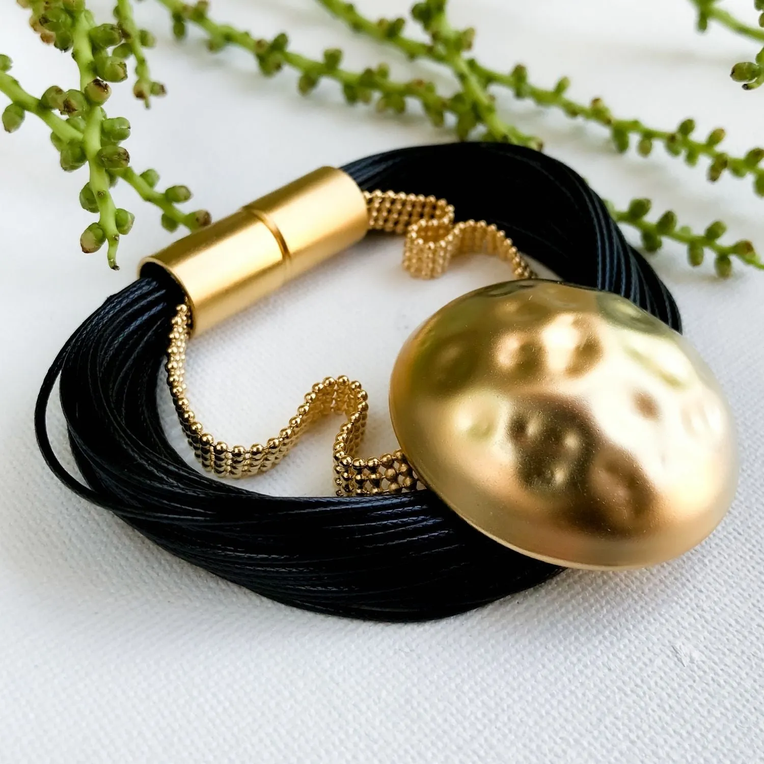 Kris - Bold black and gold pendant bracelet
