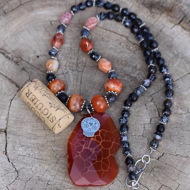 Red agate stone pendant necklace with a sugar skull charm