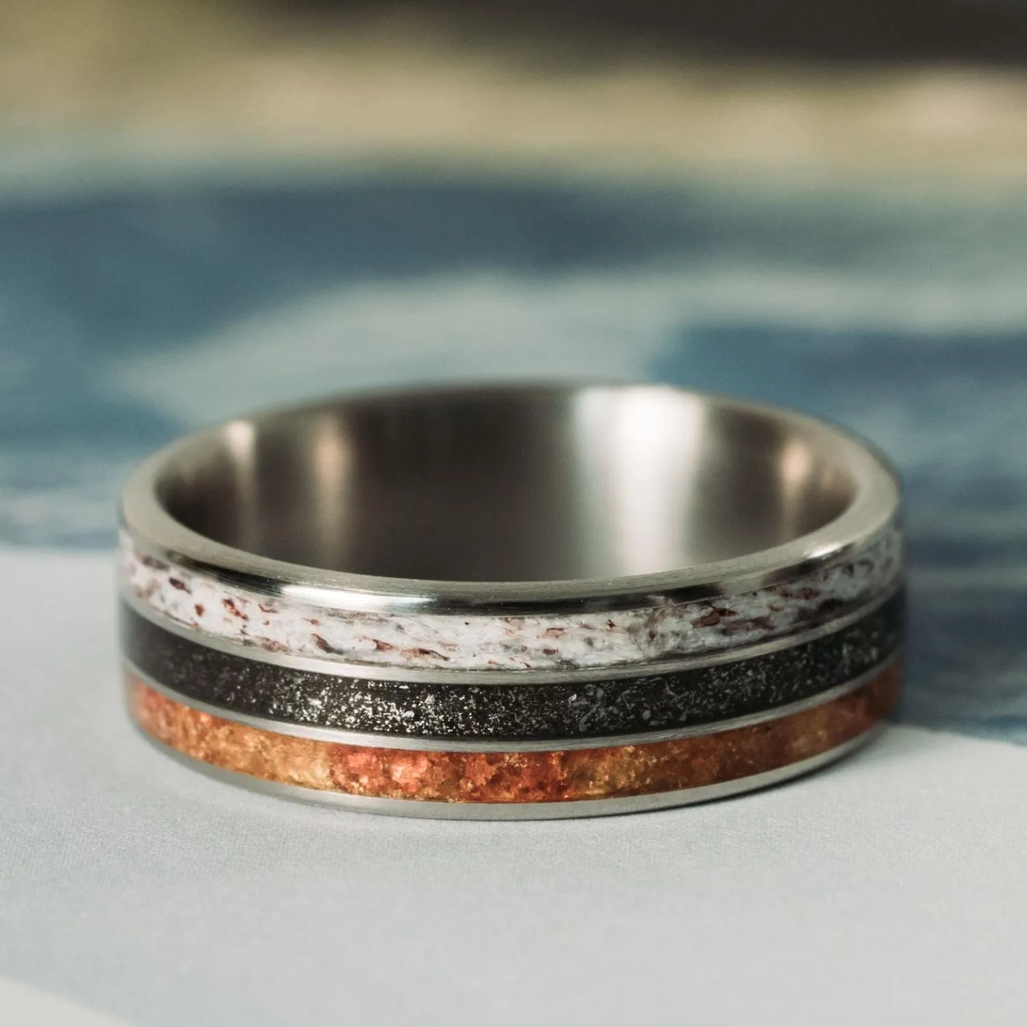 The Last Frontier | Men's Titanium Wedding Band with Elk Antler, Meteorite Dust, & Fossilized Amber