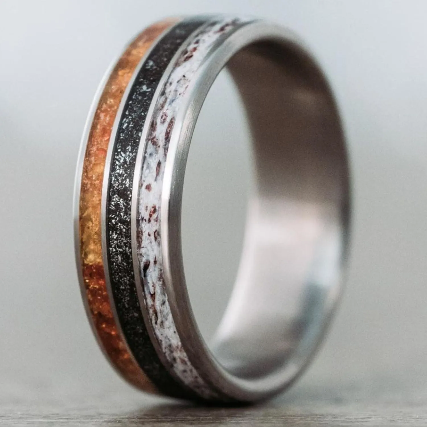 The Last Frontier | Men's Titanium Wedding Band with Elk Antler, Meteorite Dust, & Fossilized Amber